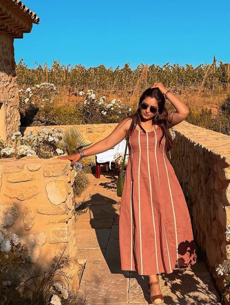 Sanchi in Rosette Dress
